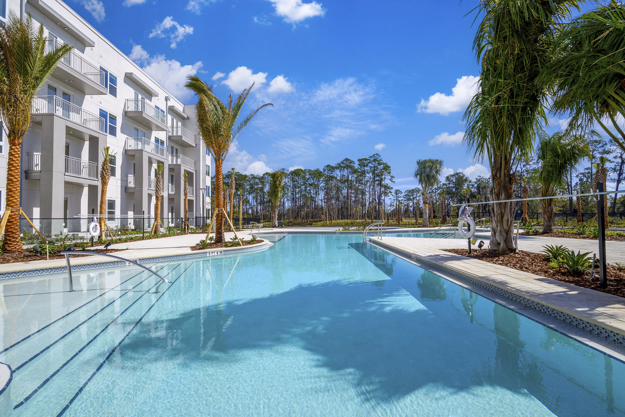 Luxurious pool with sun loungers at Novel Nona Apartments