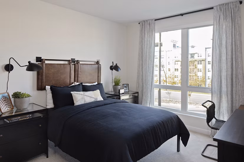 Lantana at Milpitas Station: Cozy bedroom with modern decor in luxury apartment community