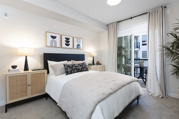 Lantana at Milpitas Station: Modern bedroom with stylish decor and natural lighting in luxury apartments