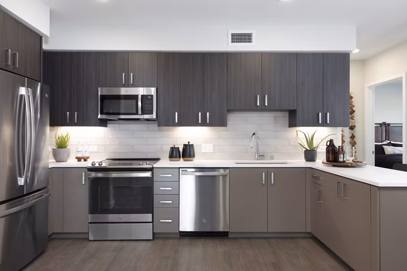 Modern kitchen featuring stainless steel appliances and sleek countertops at Lantana at Milpitas Station apartments