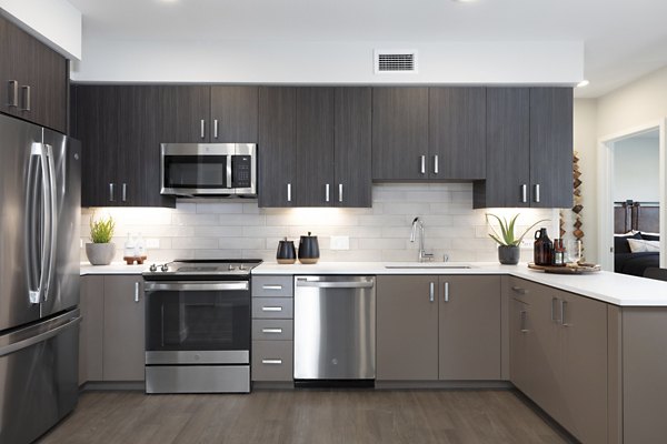 Modern kitchen featuring stainless steel appliances and sleek countertops at Lantana at Milpitas Station apartments