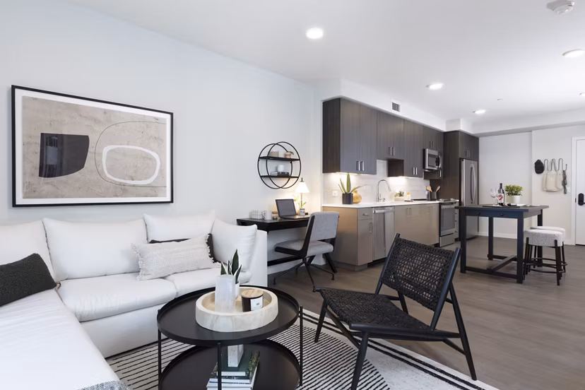 Spacious living room with modern decor in Lantana at Milpitas Station apartment, highlighting comfort and style for luxury living experiences