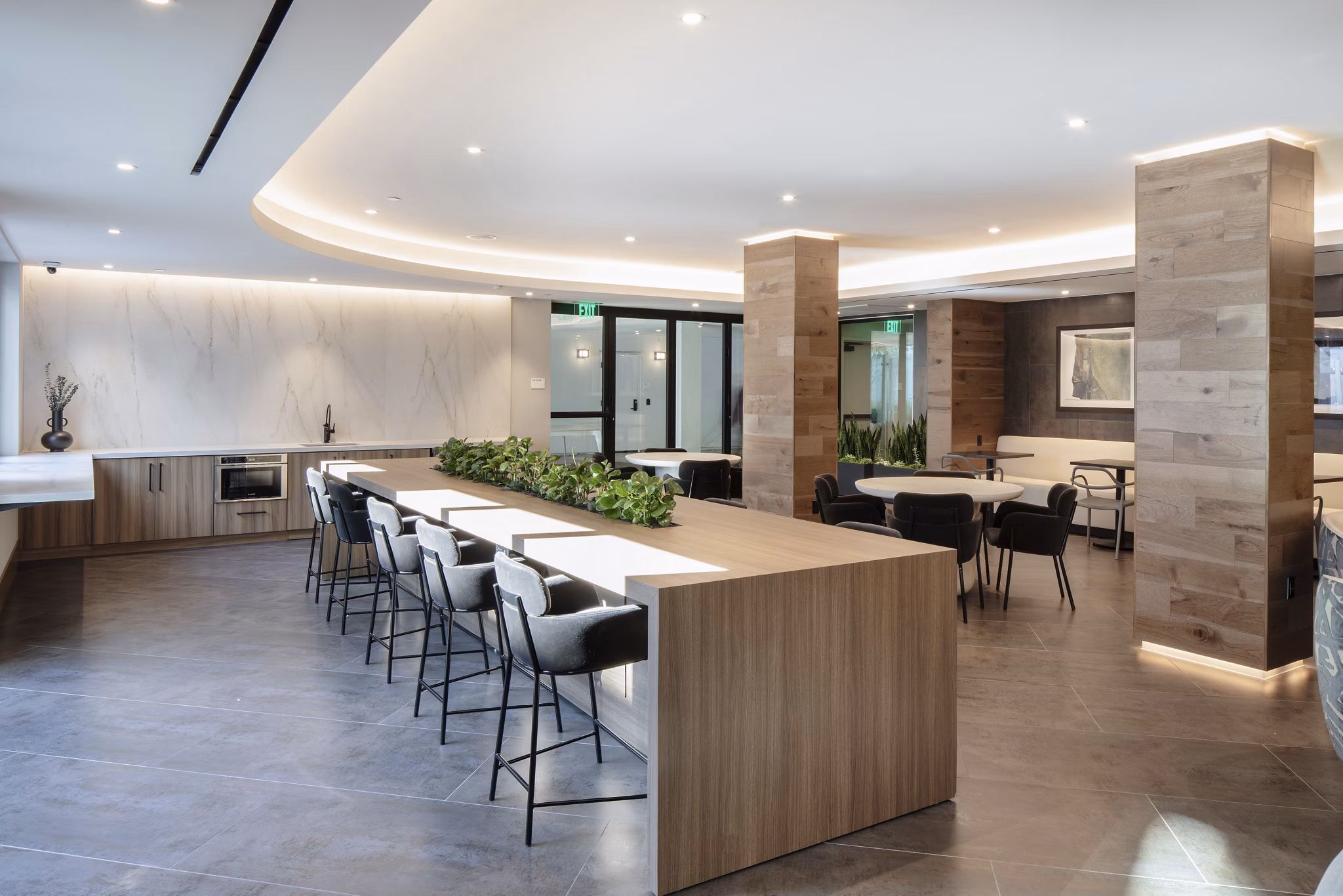 Spacious living room with modern decor and large windows in Lantana at Milpitas Station apartments