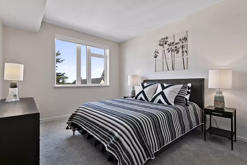 Modern bedroom with elegant furnishings at Lantana Uptown apartments, offering a luxurious living experience in an upscale setting