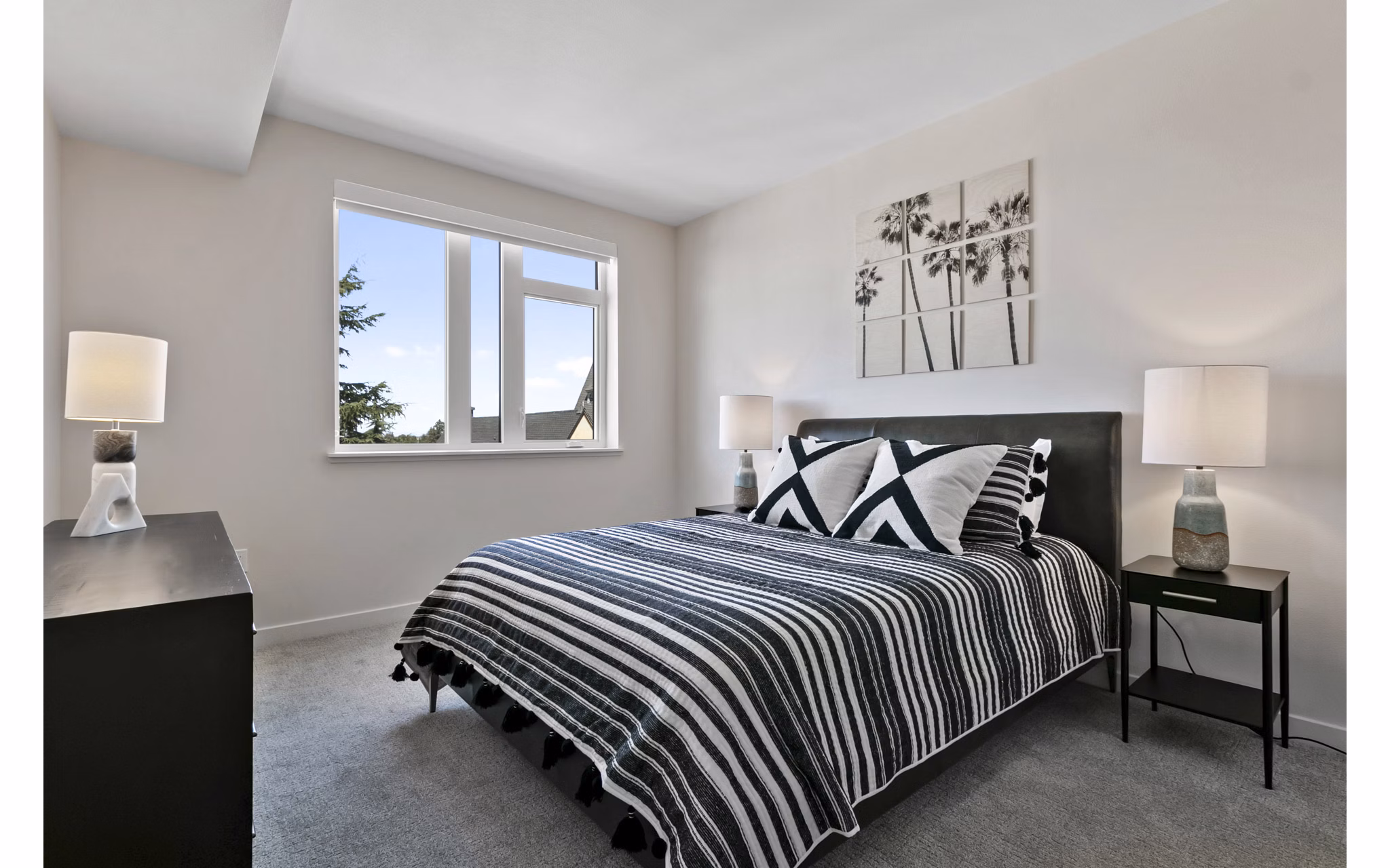 Modern bedroom with elegant furnishings at Lantana Uptown apartments, offering a luxurious living experience in an upscale setting