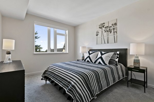 Modern bedroom with elegant furnishings at Lantana Uptown apartments, offering a luxurious living experience in an upscale setting