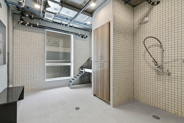 Modern bathroom with sleek fixtures and spacious vanity in Lantana Uptown luxury apartments