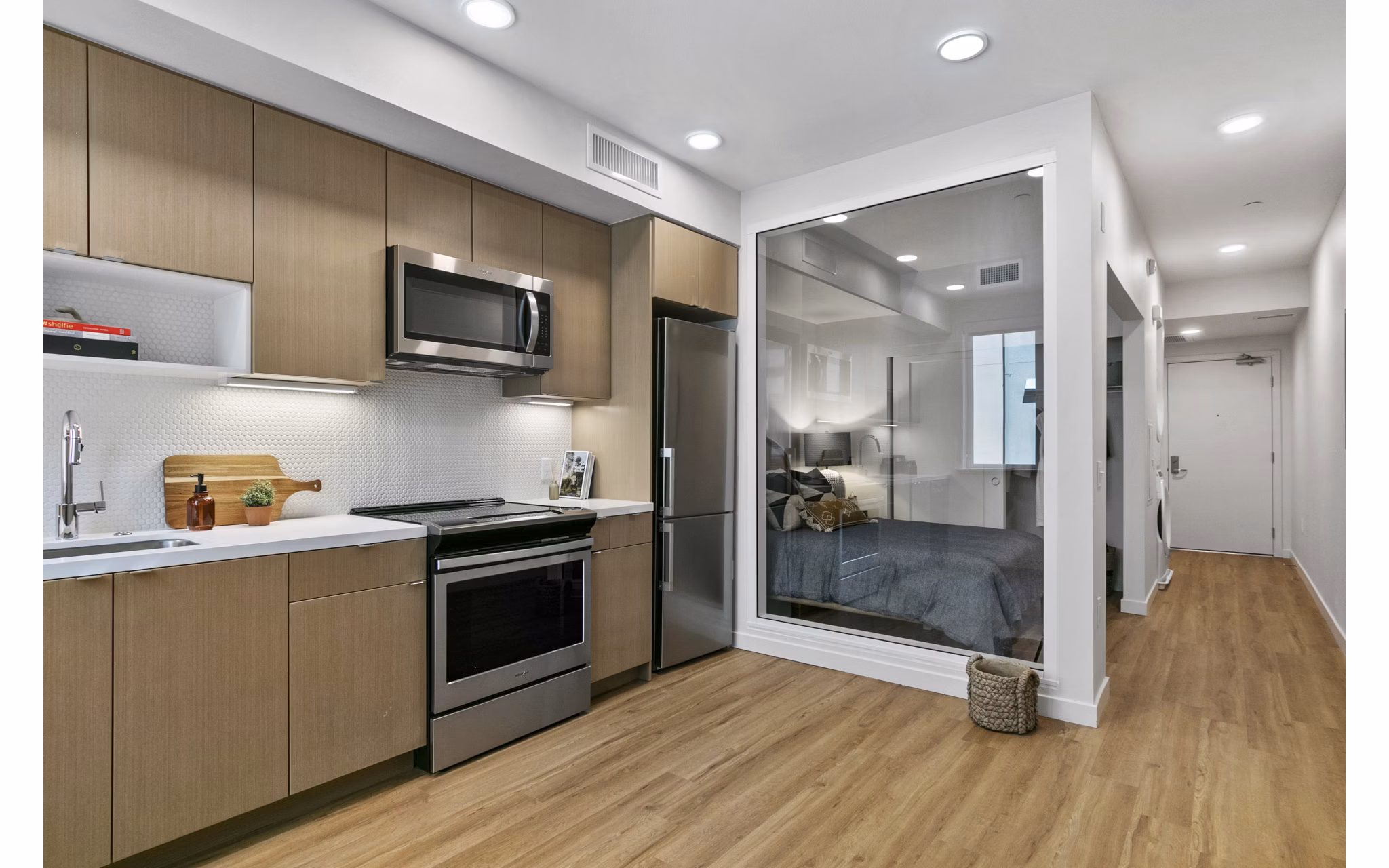 Modern kitchen featuring stainless steel appliances and granite countertops at Lantana Uptown luxury apartments