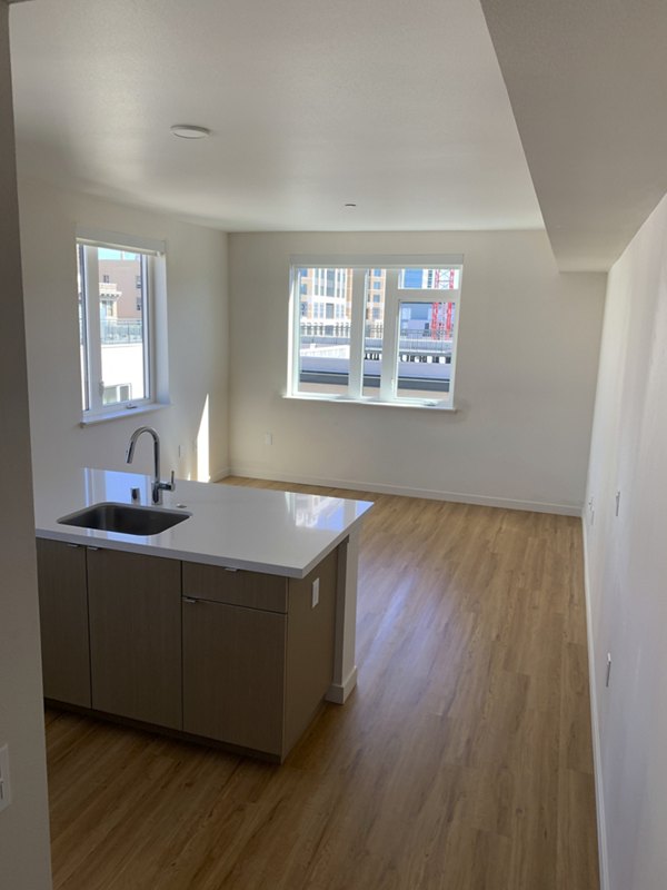 Lantana Uptown kitchen featuring modern appliances and sleek countertops in luxury Greystar apartments