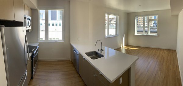 Modern kitchen with stainless steel appliances in Lantana Uptown luxury apartments