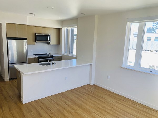 Modern kitchen with stainless steel appliances at Lantana Uptown luxury apartments