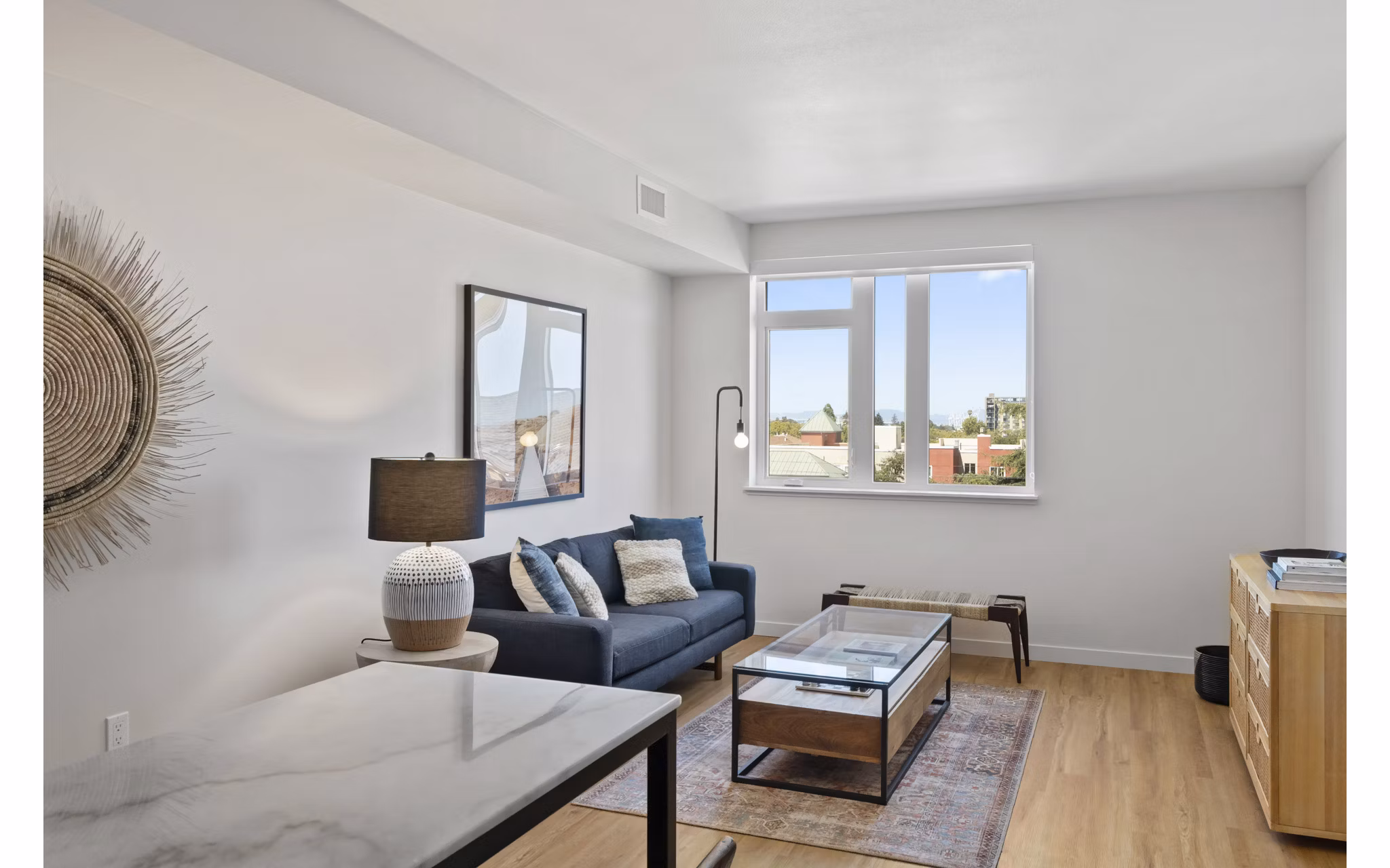 Elegant living room with contemporary decor and abundant natural light at Lantana Uptown luxury apartments