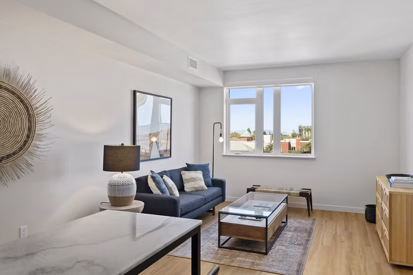 Elegant living room with contemporary decor and abundant natural light at Lantana Uptown luxury apartments
