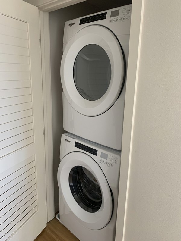 Laundry room featuring state-of-the-art washers and dryers in Lantana Uptown luxury apartments