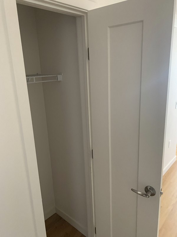 Laundry room with modern appliances at Lantana Uptown apartments in a vibrant urban setting