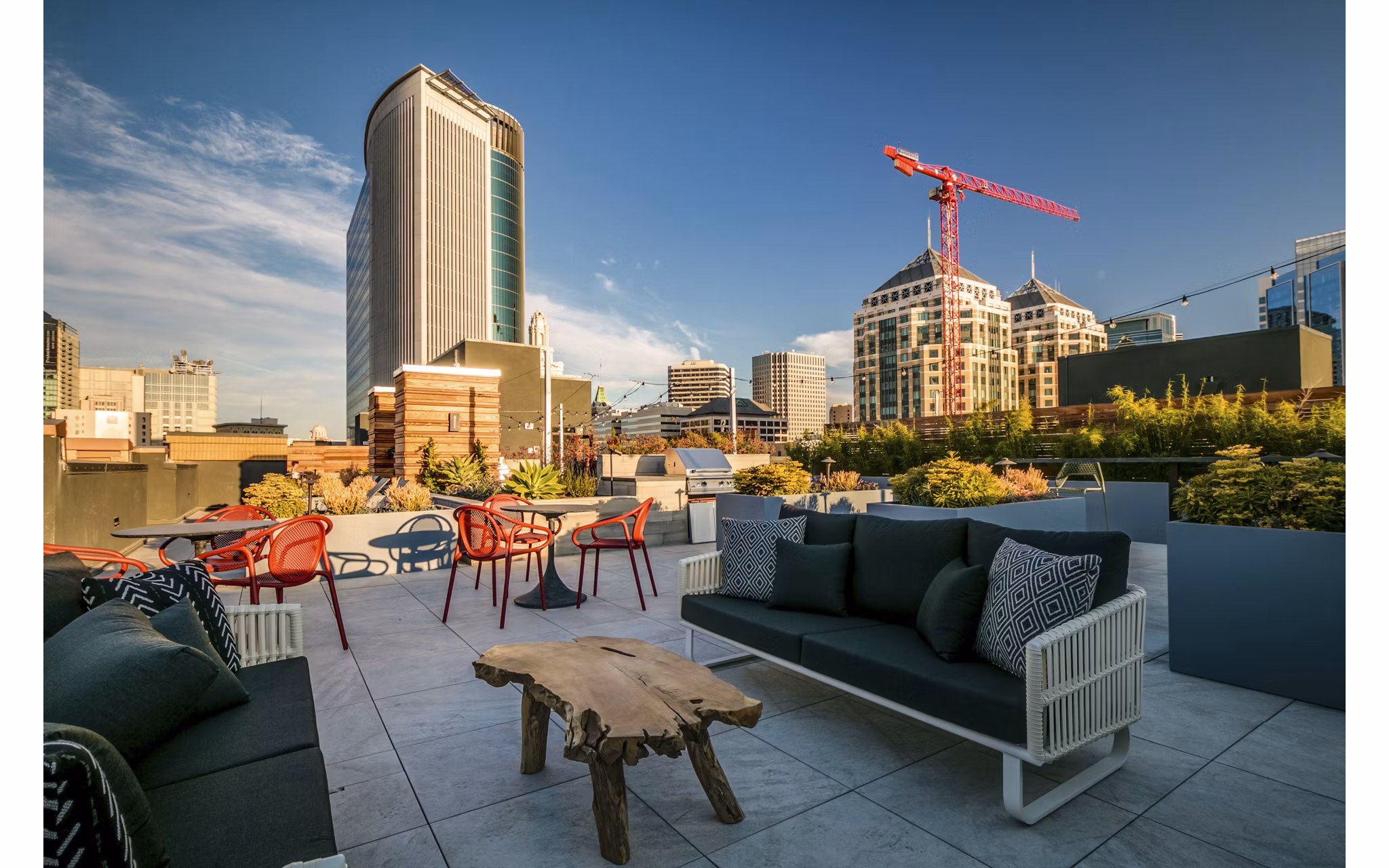 Patio featuring modern outdoor seating and lush greenery at Lantana Uptown luxury apartments
