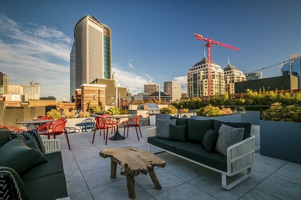 Patio featuring modern outdoor seating and lush greenery at Lantana Uptown luxury apartments