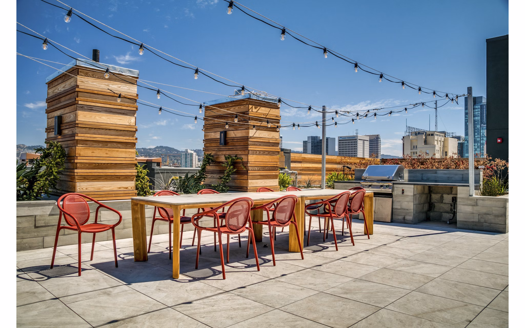 Lantana Uptown: Modern patio with stylish seating and lush greenery in luxury apartment complex