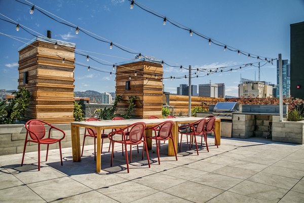 Lantana Uptown: Modern patio with stylish seating and lush greenery in luxury apartment complex