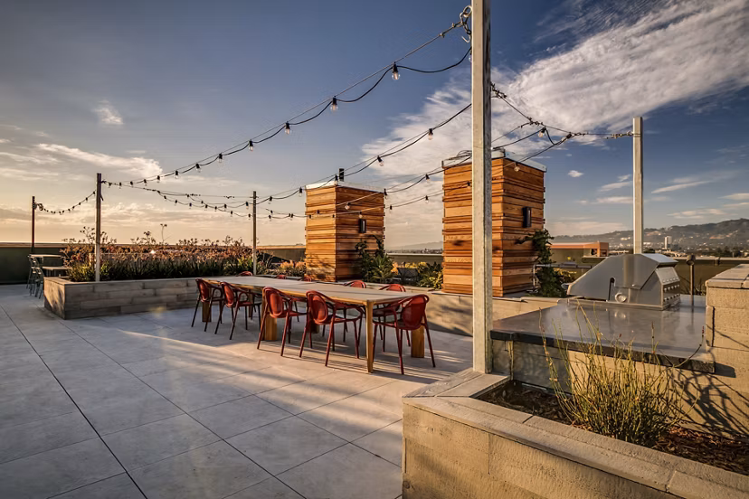 Lantana Uptown: Modern patio with stylish seating and lush greenery, luxury apartments in vibrant neighborhood