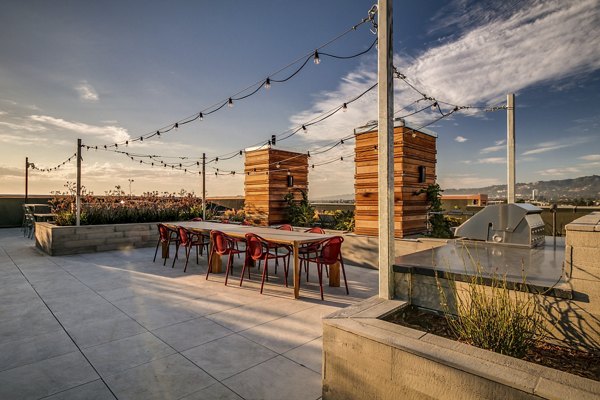 Lantana Uptown: Modern patio with stylish seating and lush greenery, luxury apartments in vibrant neighborhood