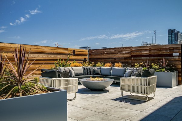 Lantana Uptown: Stylish patio with modern seating and greenery in luxury urban setting