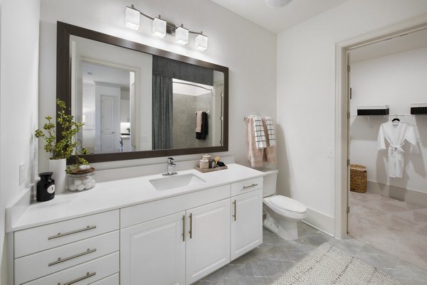 Bathroom with sleek fixtures and modern design at The Lights at Northwinds Apartments