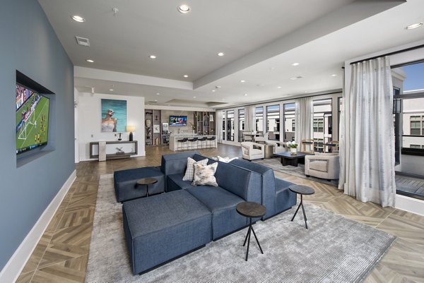 Clubhouse with modern decor and seating at The Lights at Northwinds Apartments, a luxury community offering upscale living spaces and amenities
