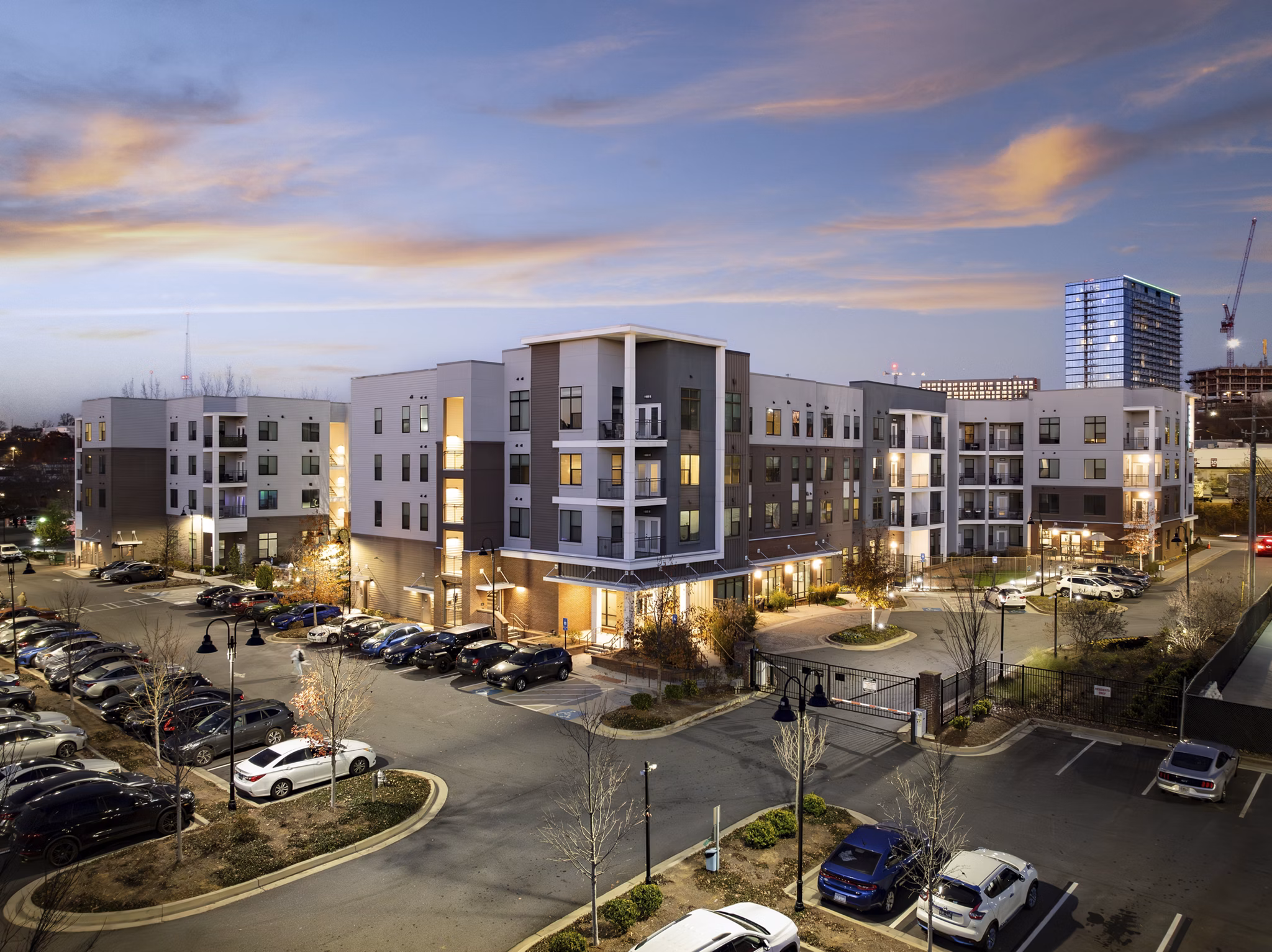 The Lowery: Contemporary luxury apartment building in vibrant neighborhood with lush landscaping