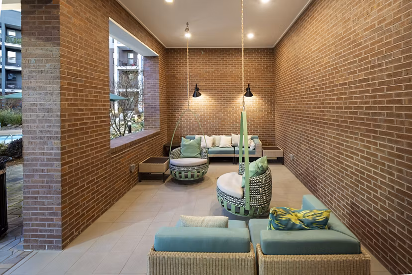 Clubhouse featuring modern decor and ample seating at The Lowery Apartments