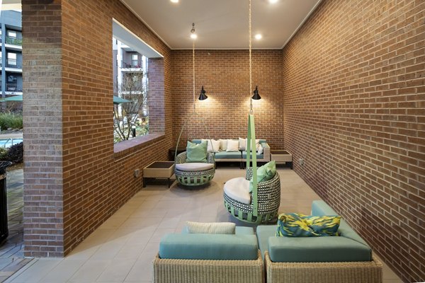 Clubhouse featuring modern decor and ample seating at The Lowery Apartments