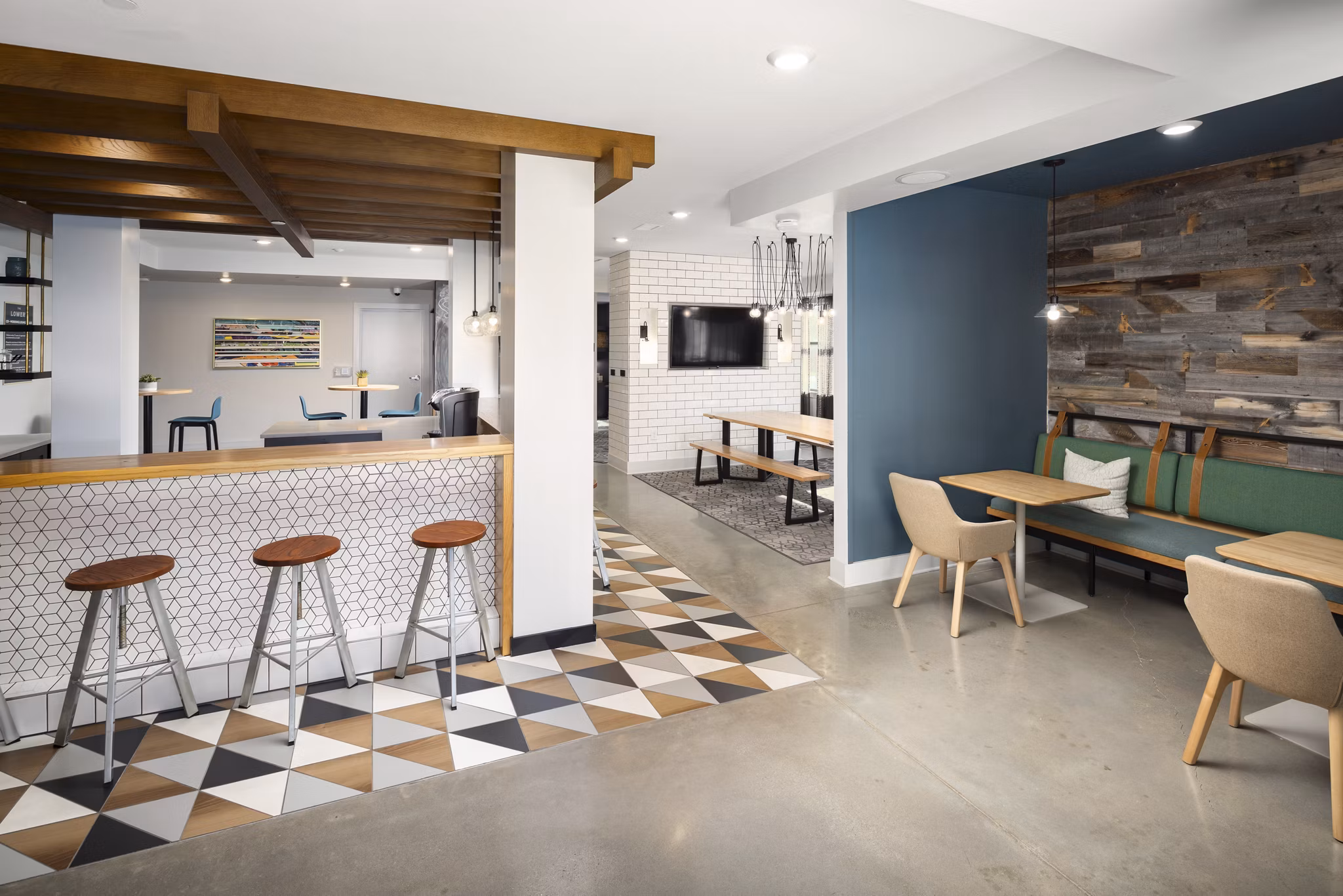 Clubhouse featuring modern design and cozy seating at The Lowery Apartments