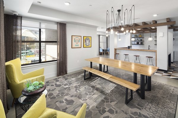 Clubhouse with modern design elements at The Lowery Apartments, featuring open spaces and cozy seating areas for residents