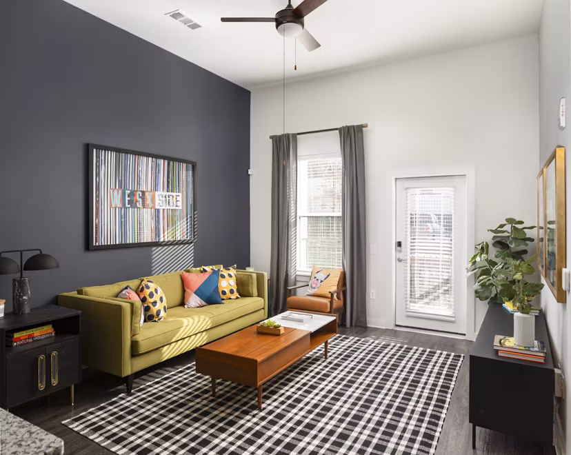 Spacious living room with modern decor at The Lowery Apartments, featuring luxury living in the heart of the city