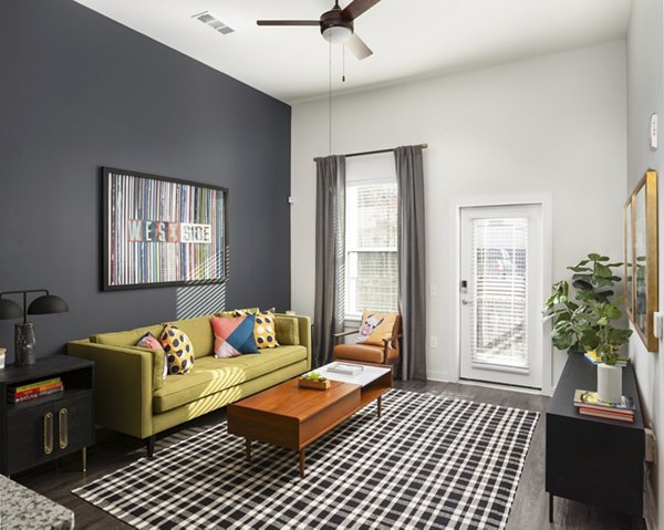 Spacious living room with modern decor at The Lowery Apartments, featuring luxury living in the heart of the city