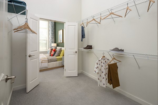 Laundry facility featuring modern machines at The Lowery Apartments in downtown, offering convenience and efficiency