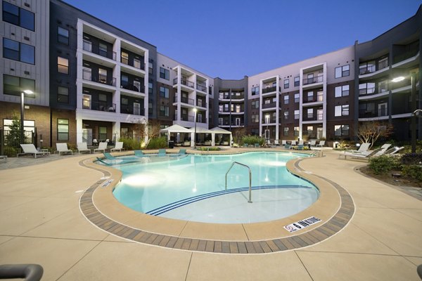 Luxury pool with cabanas at The Lowery Apartments, offering a relaxing community space for residents