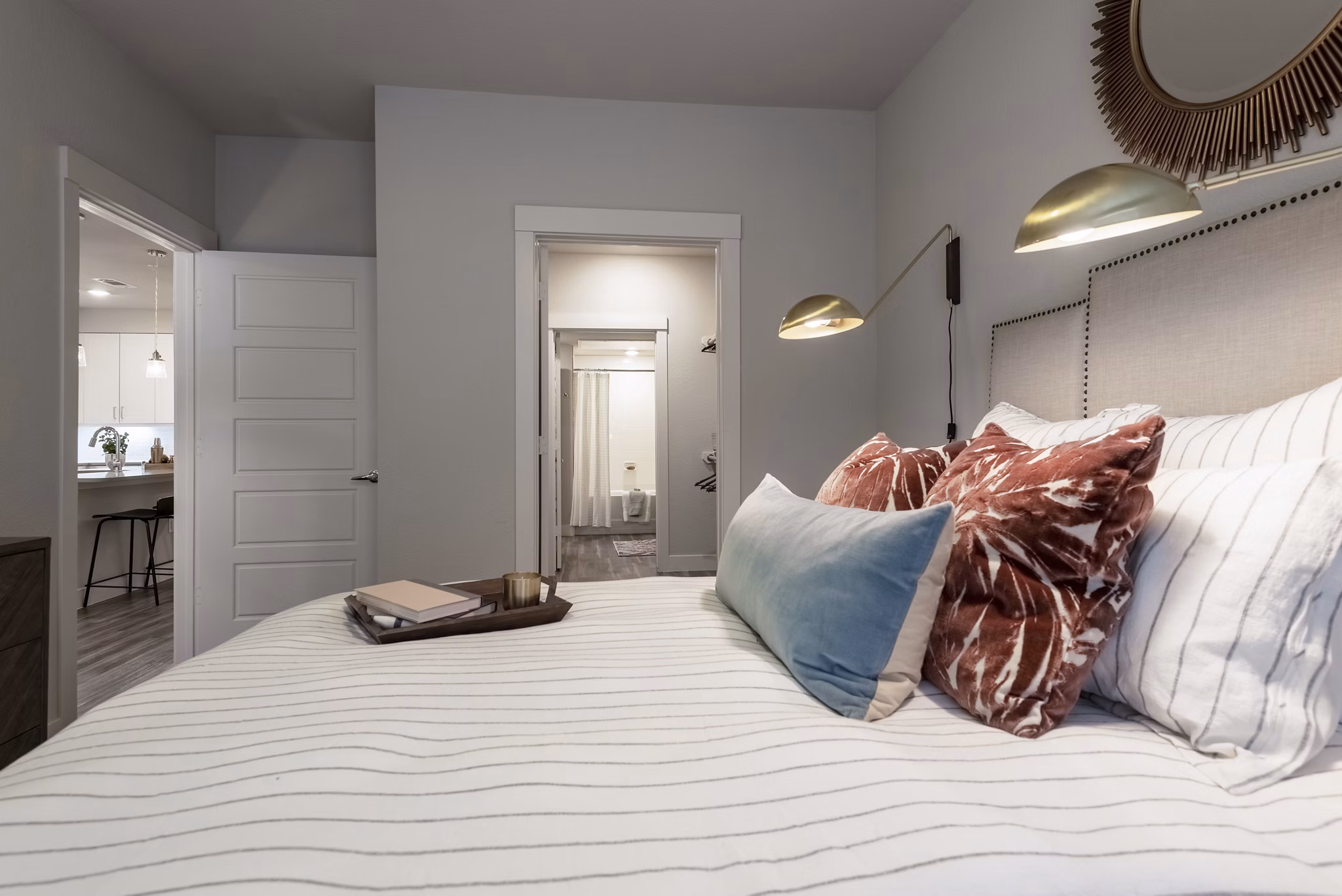 Cozy bedroom with modern decor at Luxe at Mile High luxury apartments in Denver