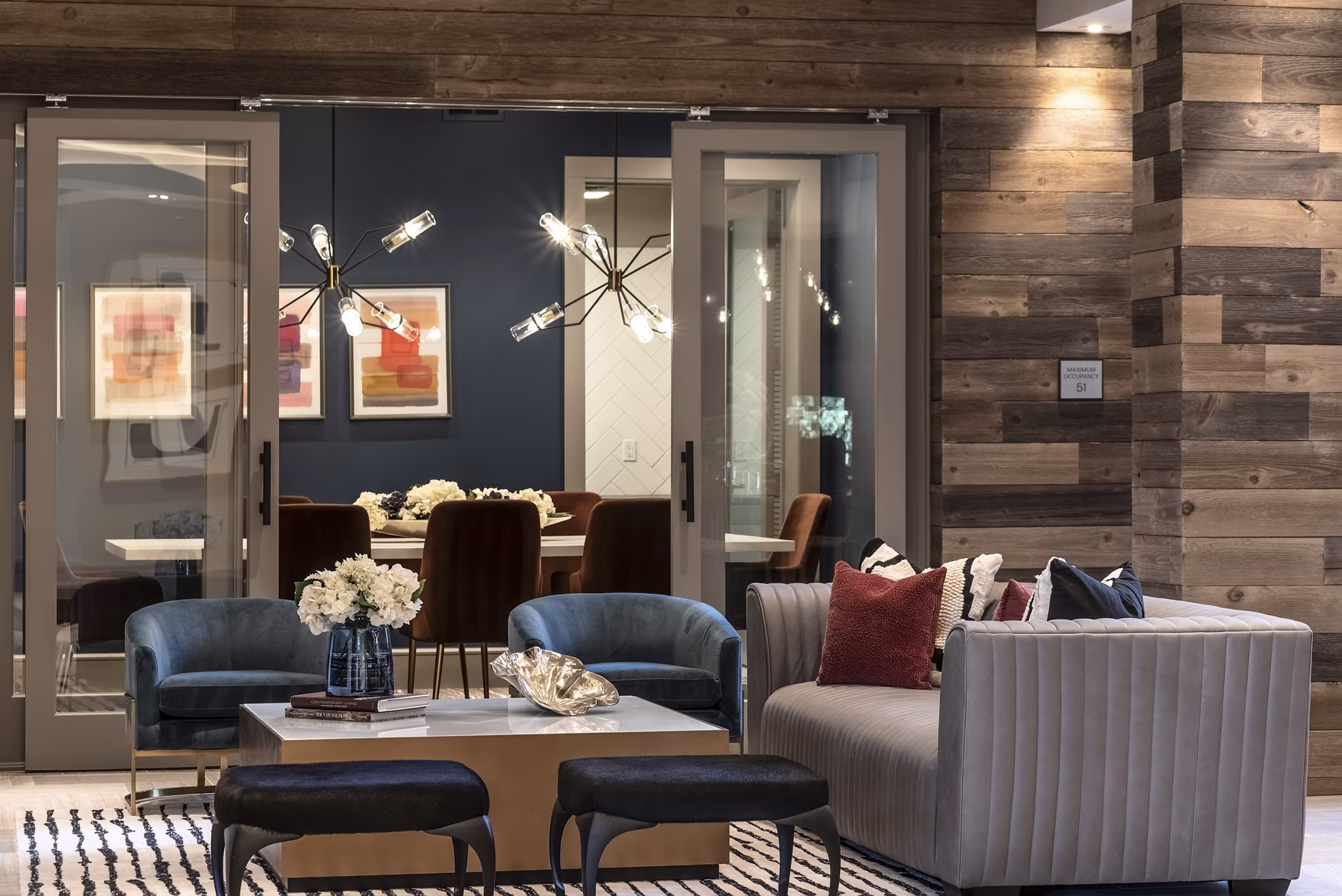 Luxe at Mile High: Elegant clubhouse with modern furnishings and large windows in Greystar luxury apartments