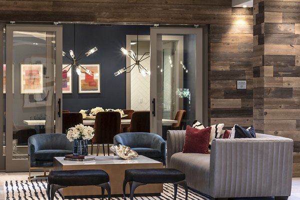 Luxe at Mile High: Elegant clubhouse with modern furnishings and large windows in Greystar luxury apartments