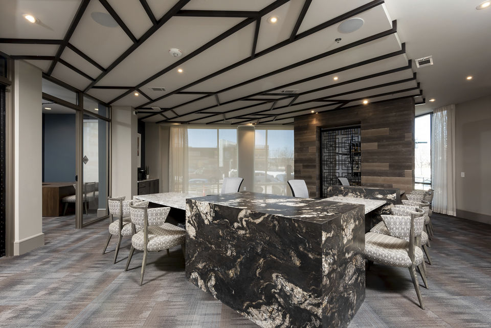 Luxe at Mile High: Elegant clubhouse featuring modern design and seating areas for residents in Denver