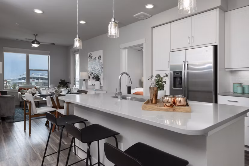 Dining area featuring elegant table setting at Luxe at Mile High apartments, showcasing sophisticated decor and modern design