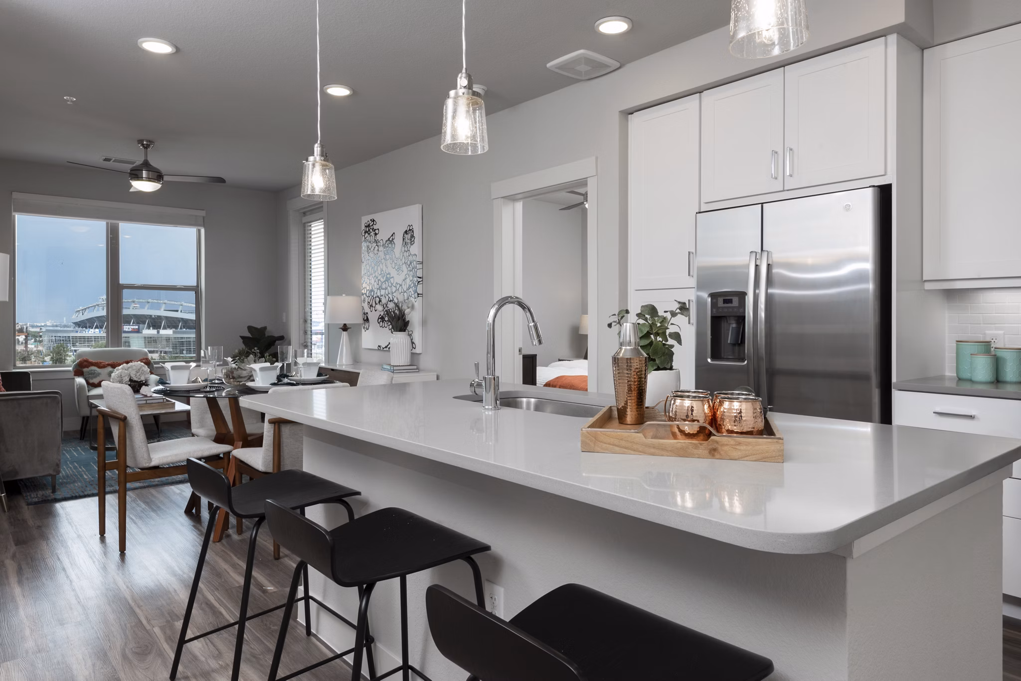Dining area featuring elegant table setting at Luxe at Mile High apartments, showcasing sophisticated decor and modern design