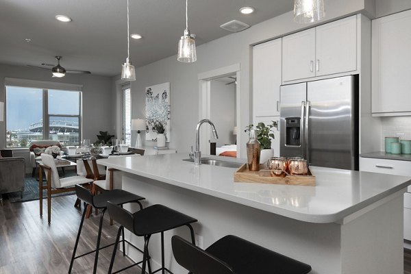 Dining area featuring elegant table setting at Luxe at Mile High apartments, showcasing sophisticated decor and modern design