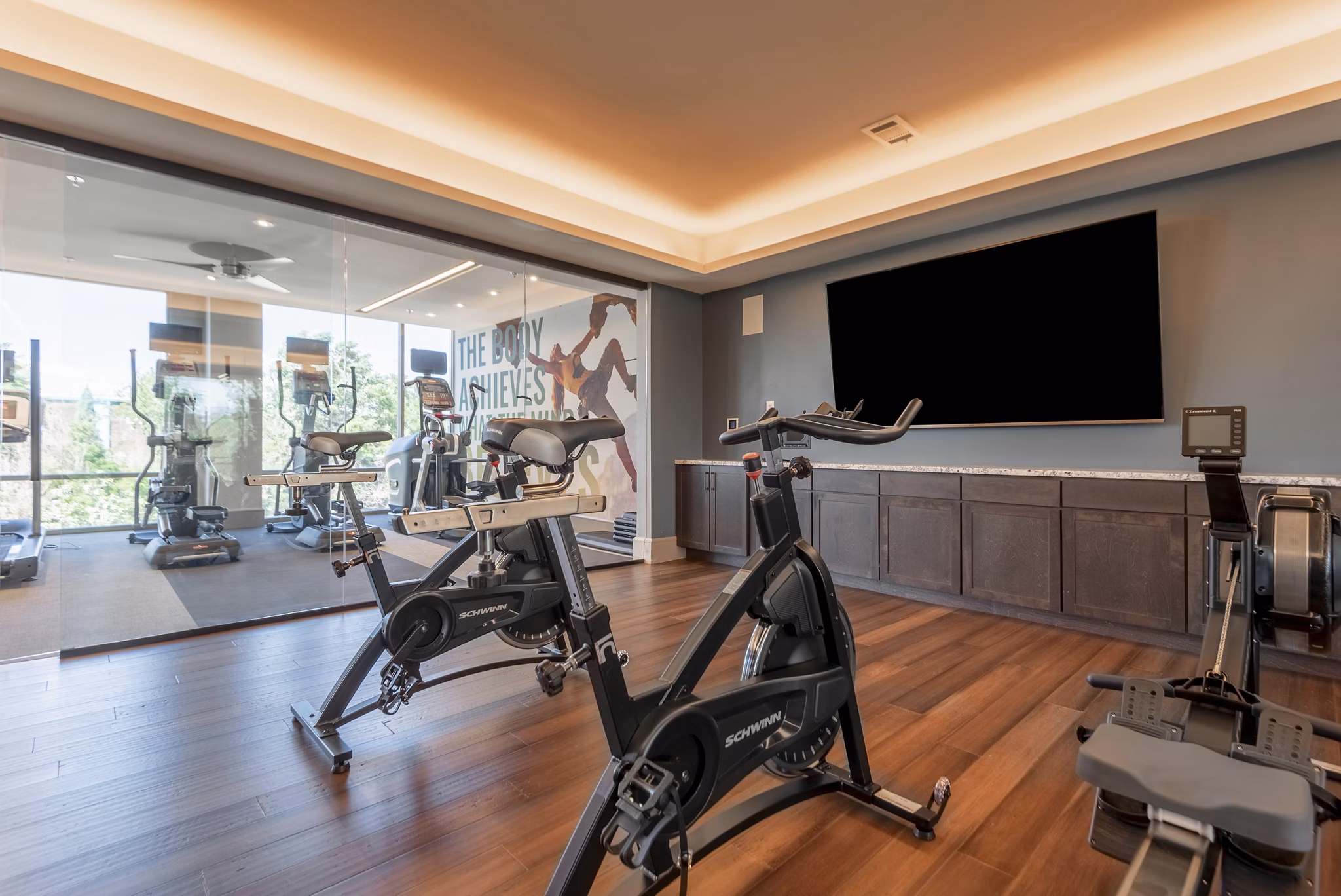 Modern fitness center with state-of-the-art equipment at Luxe at Mile High luxury apartments in Denver