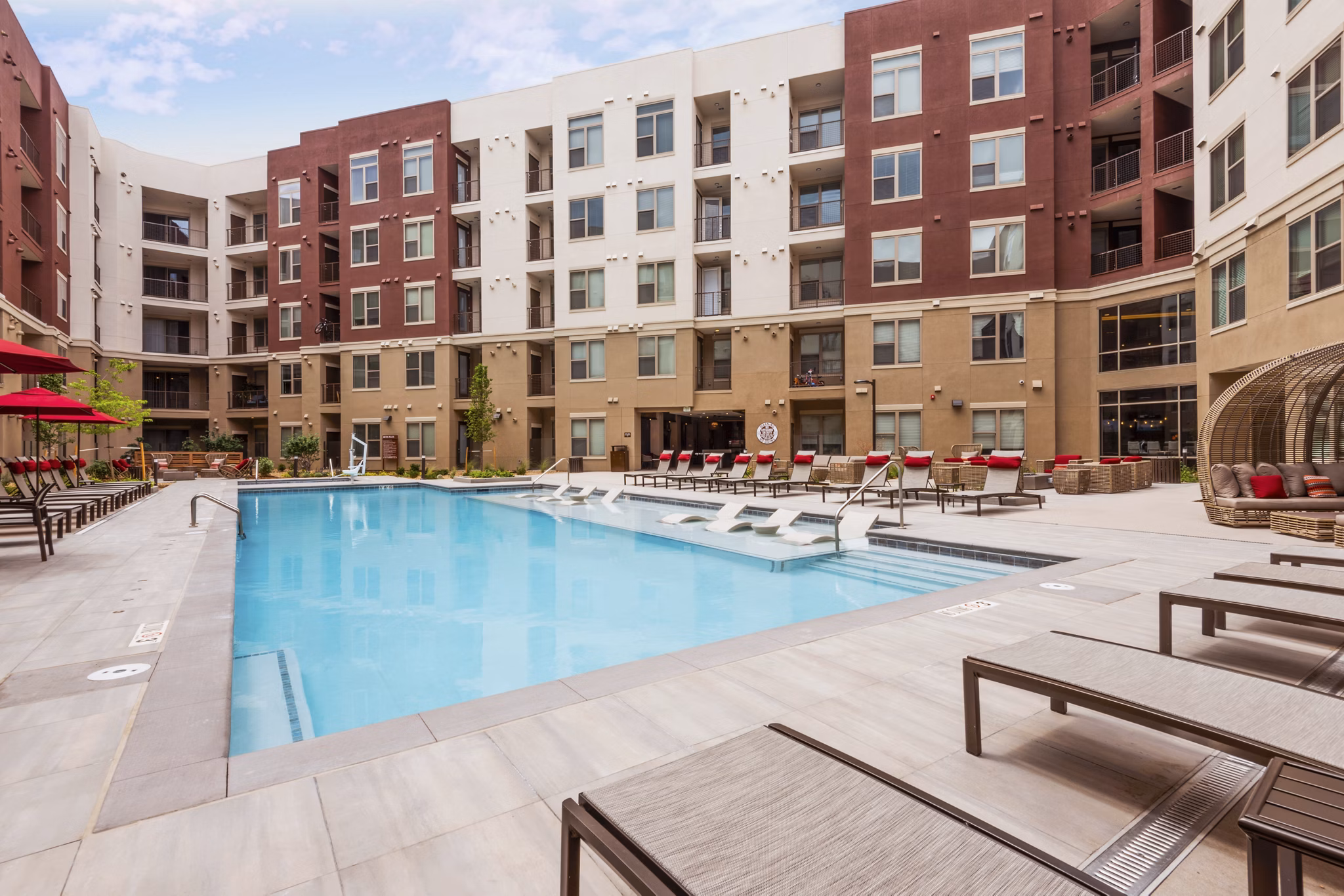 Stunning outdoor pool with mountain views at Luxe at Mile High luxury apartments