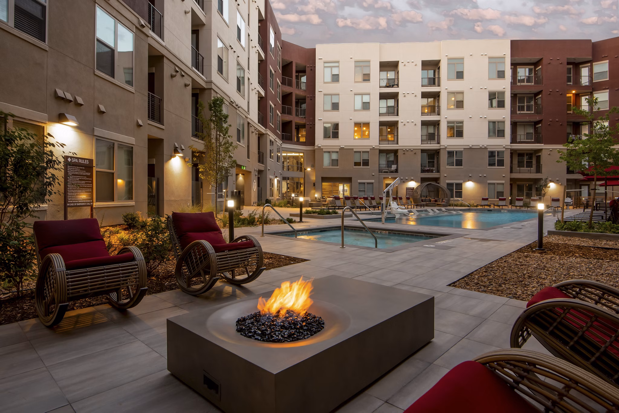 Resort-style pool surrounded by lush landscaping at Luxe at Mile High luxury apartments