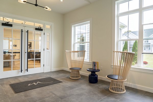 The Madison at Marshfield: Elegant clubhouse with modern decor and versatile spaces for residents' events and gatherings