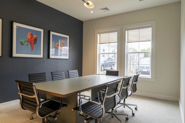 Elegant clubhouse with cozy seating and fireplace at The Madison at Marshfield luxury apartments