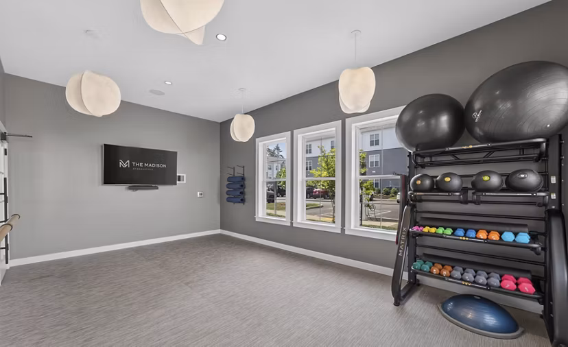 fitness center at The Madison at Marshfield Apartments